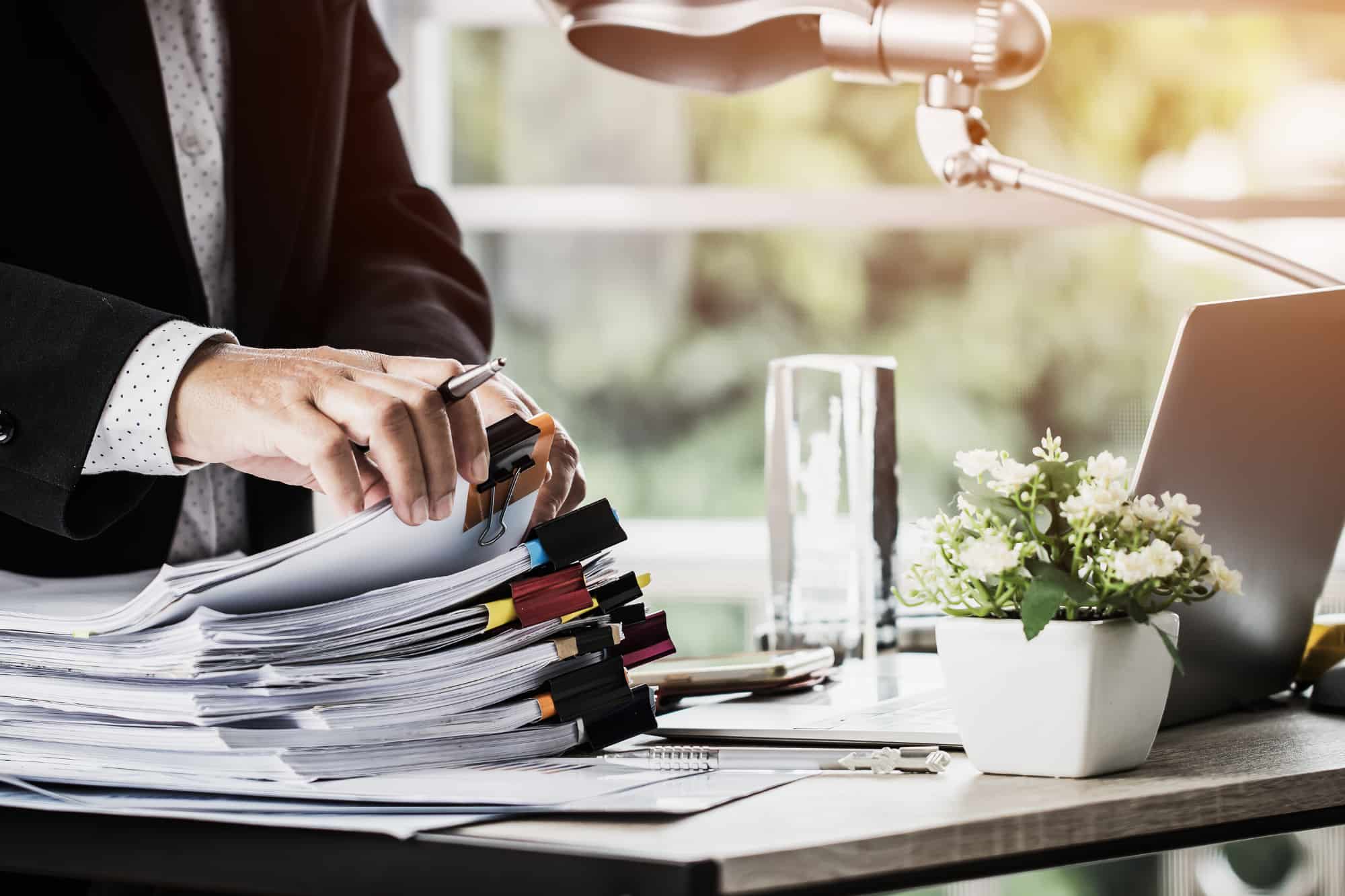 Legal papers being carefully prepared for delivery by a professional process server.