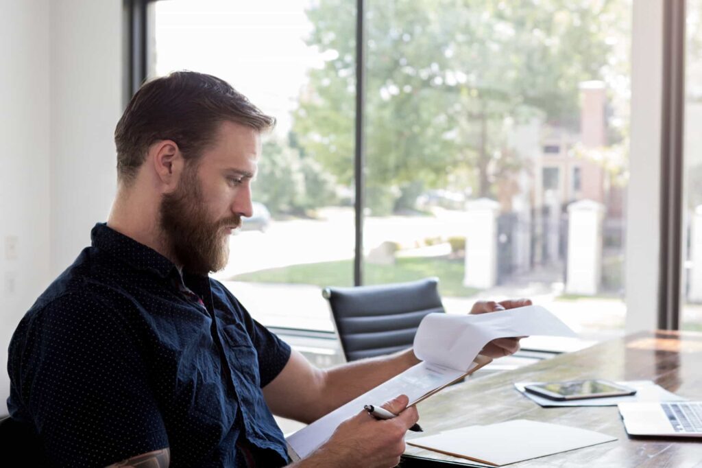 Professional process server reviewing legal procedures before delivery.