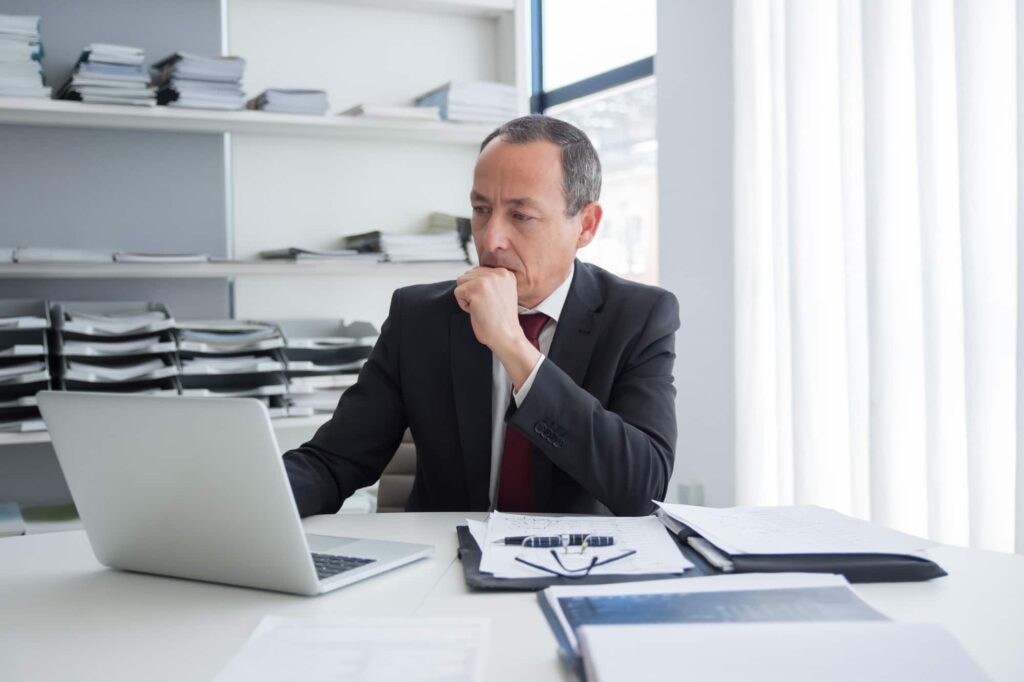 Law firm professional viewing real-time service updates from Firefly Legal on a secure portal.
