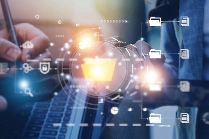 A person interacts with a digital interface, managing files and data, symbolizing the mandatory electronic filing requirements in the Cook County Circuit Court.